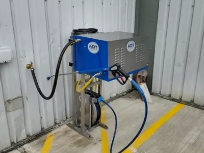 Nilfisk DTE cold static pressure washer mounted on a custom stainless steel frame with retractable hose reel for ambulance washing in Leicester. Nilfisk DTE pressure washer installed on a custom stainless frame with retractable reel for fast ambulance was